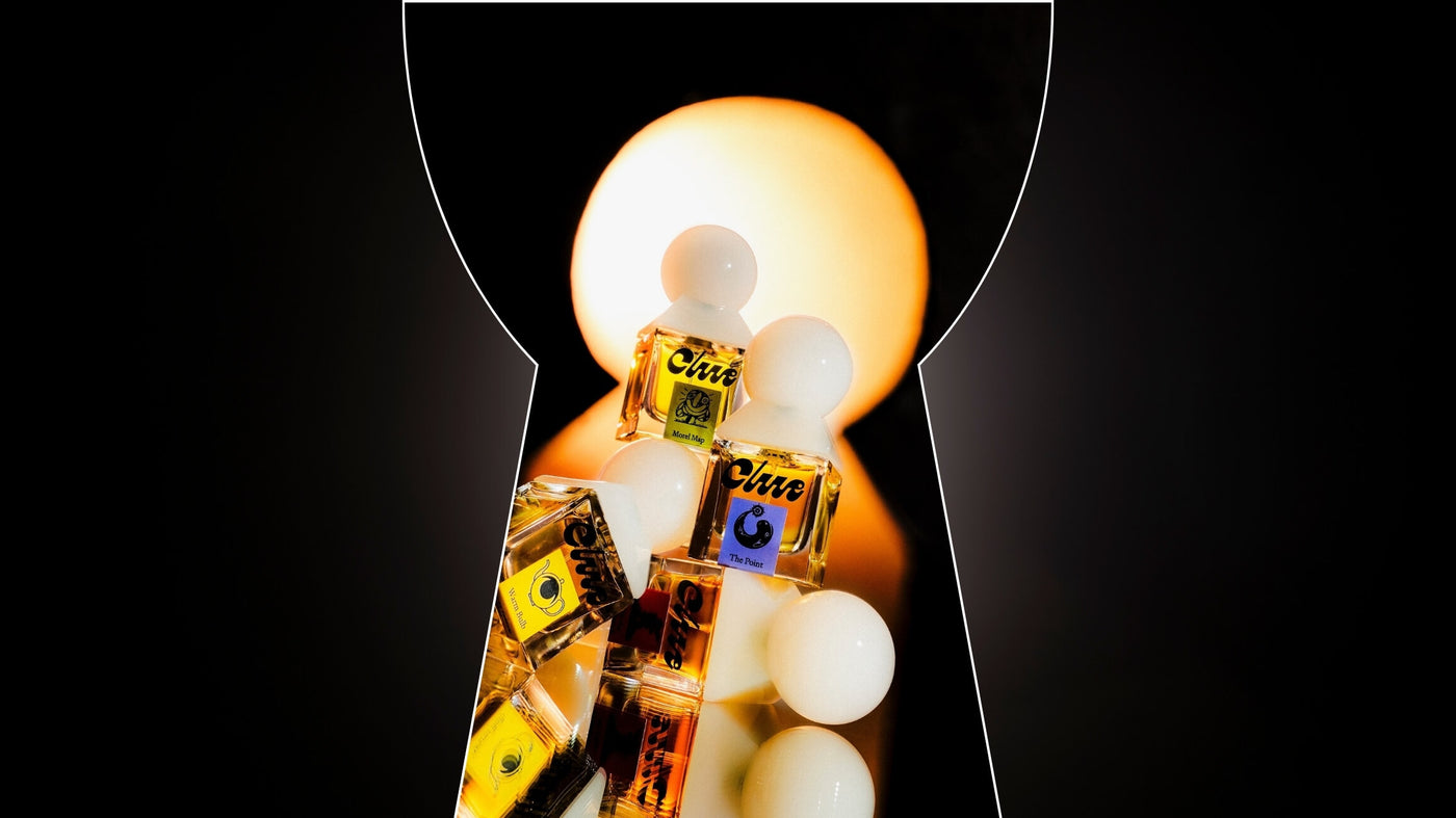 Clue perfume bottles in a keyhole-shaped vingette.